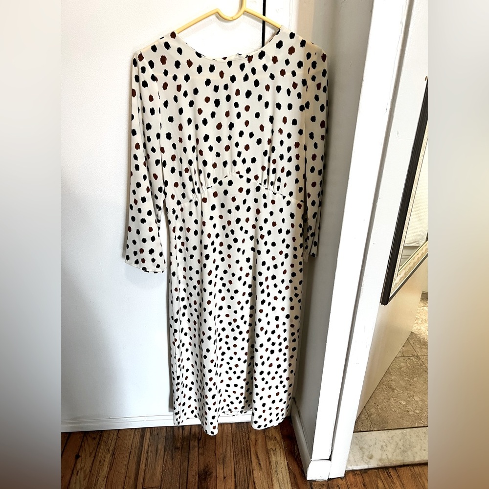 Cream dress with black and brown dots and an open back